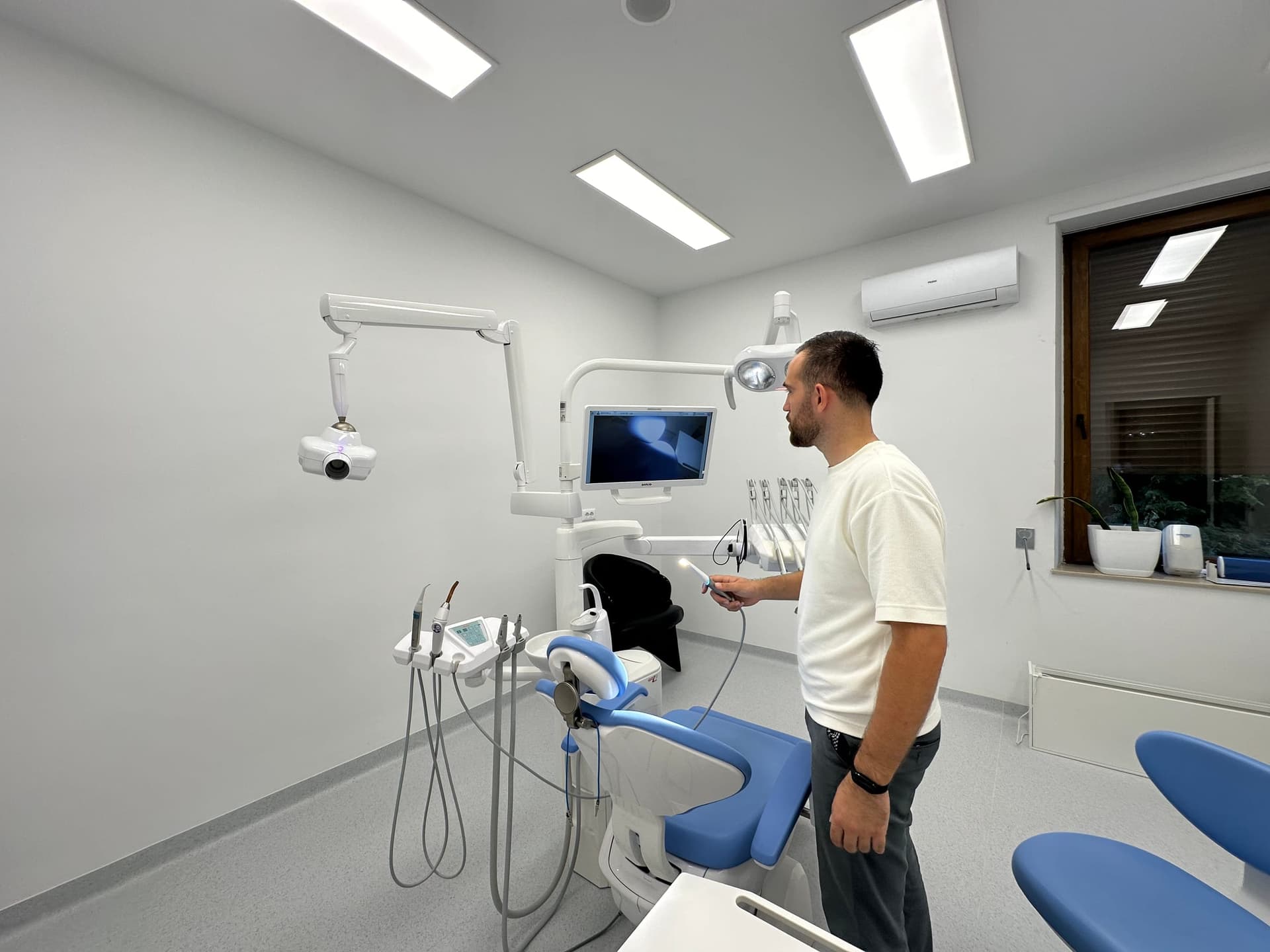 Engineer Erion Çollaku testing a newly fitted dental surgery